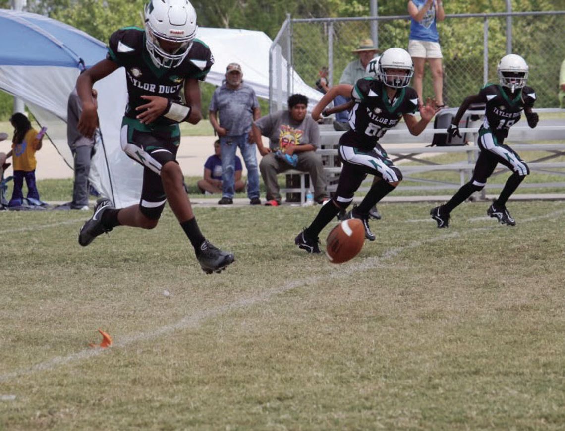 The Taylor Youth Ducks kicking off against Rockdale for their semi-final matchup. Photo by Vershiba Cook