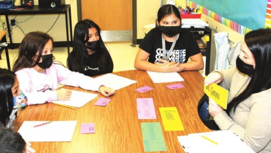 Main Street Intermediate School reading specialist Sarah Shurtz conducts a small group lesson. Photo by Tim Crow