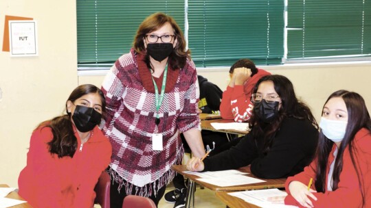 Sandra Martinez takes a break from her regular job as director of Title and English Learner Services for Taylor ISD to substitute teach at Taylor Middle School. Photo by Tim Crow