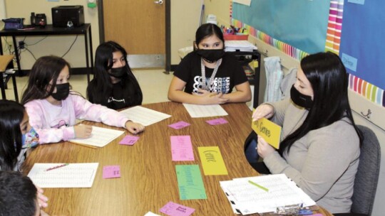 Main Street Intermediate School reading specialist Sarah Shurtz conducts a small group lesson. Photo by Tim Crow