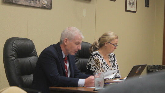 City Attorney Mark Schroeder reads ordinances with City Clerk Dianna McLean beside him during the Jan. 13 City Council meeting.