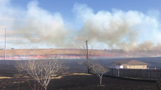 First responders survey damage after a brush fire in south Hutto Jan. 14.