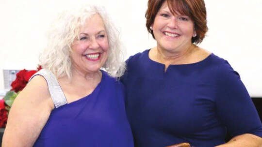 ABOVE: Julie Downs (right) receives the Customer Service of the Year award from Diana Phillips at the Greater Taylor Chamber of Commerce Awards Banquet Jan. 18, at the Williamson County Expo