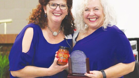 Diana Phillips (right) is the outgoing president of the chamber board, and is recognized by Chamber President Tia Stone.