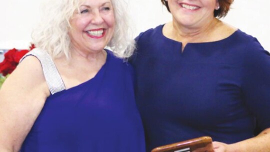 Julie Downs (right) was named Business of the Year for her contribution and sponsorship of the Music on Main event this past summer.