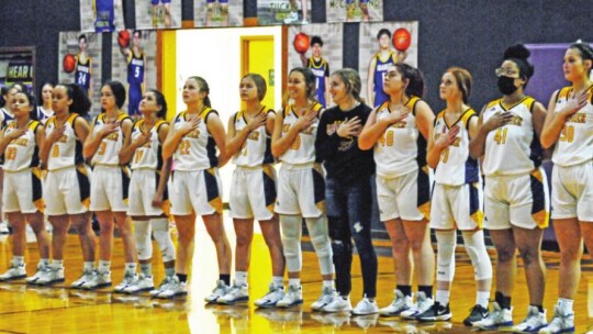 The Granger Lady Lions stand for the national anthem before their home game against Thrall. Photo by Larry Pelchat