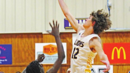 Granger and Thrall boys play on with officials masked up. Photo by Larry Pelchat