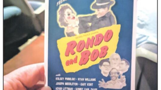 A small version of the movie poster for “Rondo and Bob” is seen here during the Jan. 22 screening of the film at the Howard Theatre in Taylor.