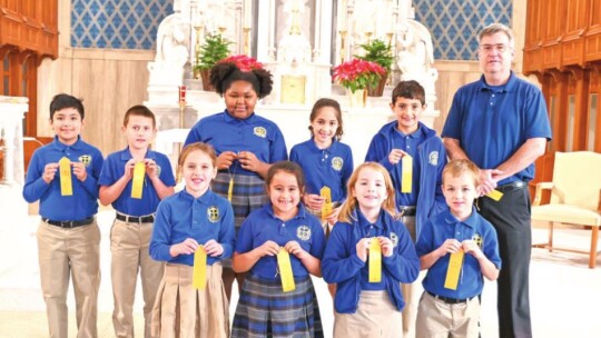 St. Mary’s Catholic School third grade students in Taylor celebrate being named to the honor roll for the second quarter of the 2021-22 school year.