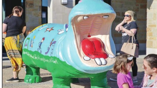 The large colorful hippo in front of city hall welcome everyone who came to celebrate World Hippo Day.