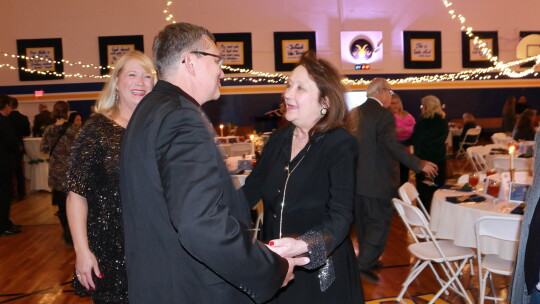 The Rev. Father Keith Koehl greets Cecilia Abbott as Heidi Altman is seen in background. Courtesy photos