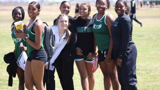 The Lady Ducks track team are ready to get things started at the 2022 Cotton Bowl Relays. Photo by Matt Hooks