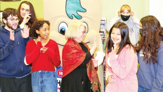 Julianna Gonzales congratulates her teacher, Vicki Rowe, with a high five in honor of Rowe being named a finalist in the HEB Excellence Award. Photo by Tim Crow