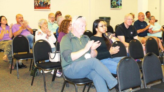 Audience members applaud a speaker during the candidate forum at the Taylor ISD Main Streets Event Center in Taylor April 11.