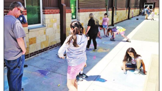 Students wrote messages in sidewalk chalk to thank the military for their service. Photos courtesy of the City of Hutto Facebook page