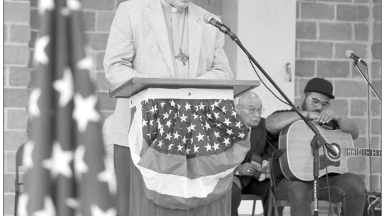 Pastor George Qualley speaks on goverment as one of seven speakers who spoke on the seven centers of influence for the National Day of Prayer marked May 5 in Taylor.