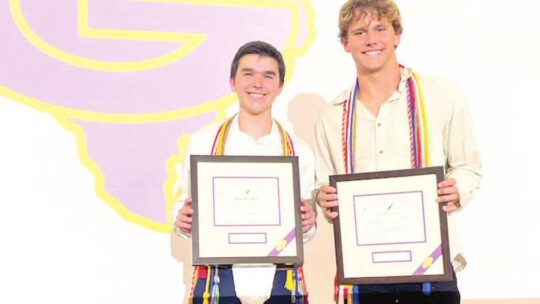 Hunter Prinz (left) and Johnny Ryder stand with their respective valedictorian and salutatorians awards from Granger High School for 2022. The pair of Lions and their den will graduate Saturday, May 28, at the Taylor ISD Events Center. Courtesy photos