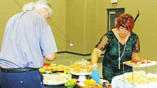 Julie Downs enjoys hors d’oeuvres at the Greater Taylor Chamber of Commerce’s Casino Night Gala in Taylor May 21. Photos by Fernando Castro