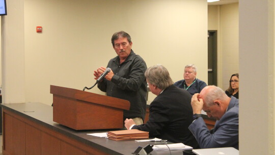 Tim Mikeska asks questions to Taylor ISD’s consultants during a public hearing during their Taylor ISD school board meeting in Taylor May 24.  Photo by Fernando Castro