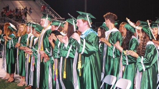 Graduating seniors sing the school song one final time as a class. Photo by Matilda Rydell