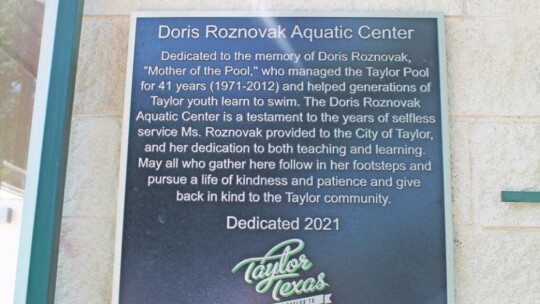 A plaque explains the name of the Doris Roznovak Aquatic Center at Murphy Park in Taylor in this May 28 photo.