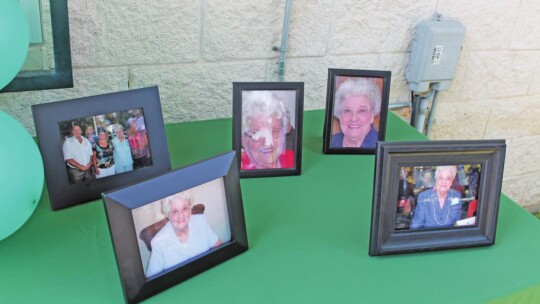 Framed photographs of Doris Roznovak adorn a table at Murphy Park in Taylor May 28.