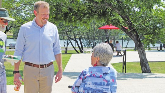 Tyler Bybee talks with Irene Michna at Murphy Park in Taylor May 28