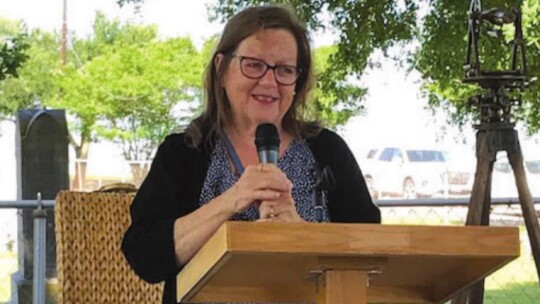 Mickie Ross, Williamson County Historical Commission historical marker committee chairman, discusses the process of getting a marker during a ceremony at Type Church near Coupland May 14.