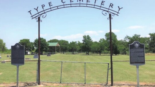 Flanking the Type Cemetery sign are the markers for the cemetery on the left and Post Oak Island at right.