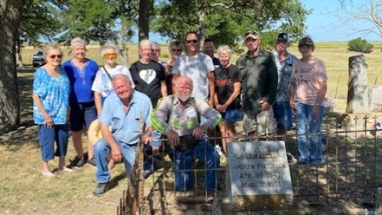 Members of the Coupland Sons of Hermann decorate the historic Mager Cemetery for Flag Day. Photo courtesy of Bonnie Kaderka