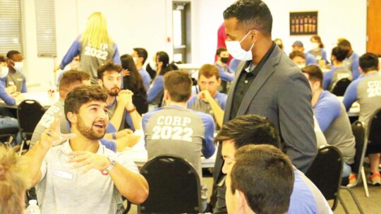 Devin Padavill, Taylor ISD superintendent, talks to a Samsung engineer about his choice to be an OU fan.