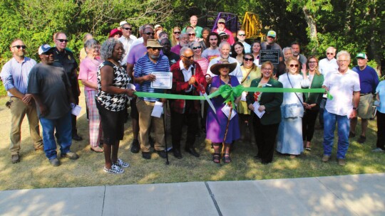 Community members and elected officials came together for a ribbon cutting to open the newly restored Dickey bridge that crosses over Mustang Creek. Photos by Jason Hennington