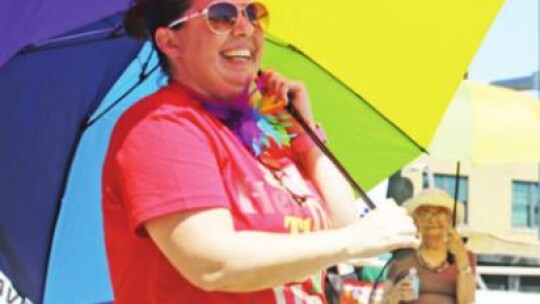 Sheyenne Alverez enjoys the music while also serving as a member of the Parasol Patrol at the Taylor PRIDE Arts and Music Festival. Photo by Jason Hennington