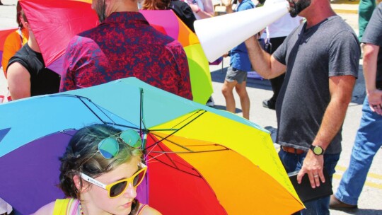 While reading Bible verses, protesters were ignored and met with rainbow umbrellas. Photo by Jason Hennington