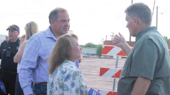 Commissioner Russ Boles, (left), Granger Mayor Monica Stojaník and County Judge Bill Gravell converse after a celebration of improvements near the intersection of Davilla and Walton streets in Granger June 22. Photo by Fernando Castro