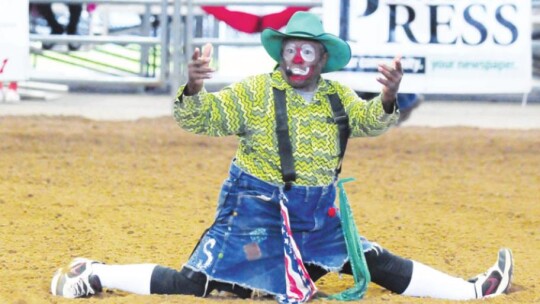 The legendary Leon Coffee is a rodeo clown. He works the crowd and keeps them entertained but keeps his barrel close just in case a bull comes after him. Photo by Larry Pelchat