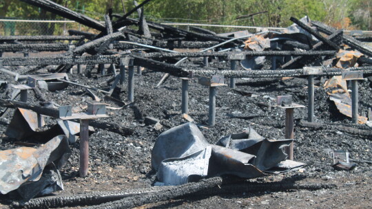 Burned rubble and grass fill the planned site of the Dickey Museum and Multipurpose Center in the 500 block of Burkett Street in Taylor July 10 Photo by Fernando Castro