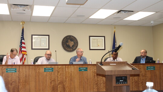 The Taylor City Council votes on one of several items related to a planned Samsung Austin Semiconductor plant during a meeting at City Hall in Taylor July 14.  Photo by Fernando Castro