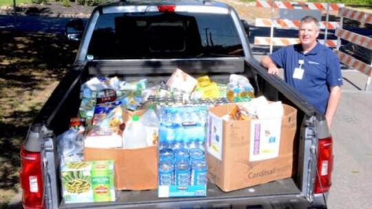 Tim Tarbell, Baylor Scott & White president, delivers 1,194 pounds of food donated by Baylor Scott & White employees.