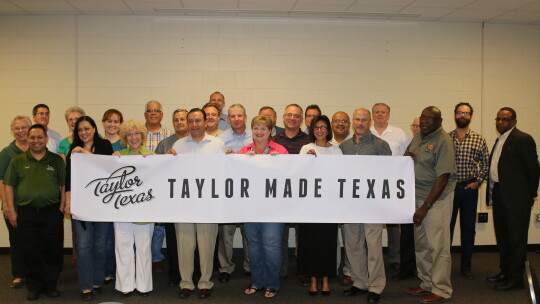 Anita Allen Volek (front center, right) is shown with a group of local citizens involved with developing the Taylor Made Texas promotion in 2014. She continues to serve her community as the new executive director of the Taylor Educational Enrichment (TEE) Foundation. Photo by Tim Crow