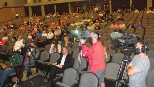 News crews and residents pack the auditorium at Main Street Intermediate School in Taylor Sept. 8, 2021. A public hearing and joint meeting between Taylor and Williamson County elected officials pertained to agenda items that would incentivize Samsung Austin Semiconductor to build a manufa...