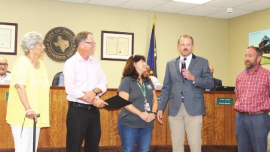 Pictured are (from left) Parks and Recreation board member Irene Michna, Councilmember Mitch Drummond, parks administrator Lisa Buzan, Parks and Recreation director Tyler Bybee and parks supertintendent Casey Cunningham during the Taylor City Council meeting July 14 as a proclamation Is is...