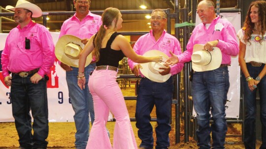 cholarship recipient Mallory McDaniel is congratulated by members of the Taylor Rodeo Association during an awards ceremony at the 72nd Taylor rodeo Friday night.