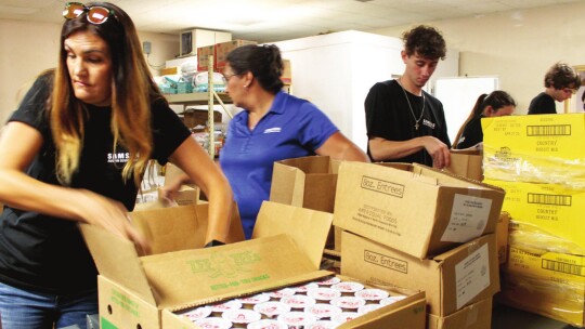 Jennifer Sabrsula, Christina Combs, Matt Aplin, Savannah Coy, Seth Fluker and Agustin Calderon volunteer at Shepherd’s Heart Food Pantry and Community Ministries July 21 as part of an organized volunteer opportunity for Samsung Austin Semiconductor. Photo by Fernando Castro INTERNS