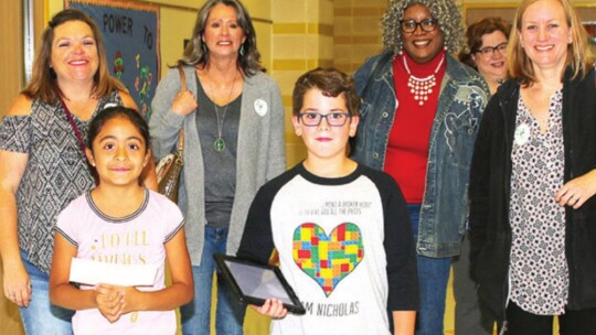 Two students at Naomi Pasemann Elementary School lead a guided tour of their school for the Taylor ISD Ambassadors in 2018.