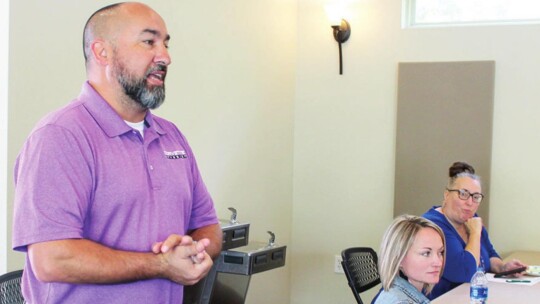 Councilmember Robert Garcia thanks Samsung Austin Semiconductor for the information session in Taylor Aug. 4. Denise Rodgers, who presents the Taylor PRIDE nonprofit group, sits to his left. Photo by Fernando Castro