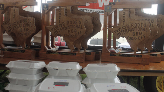 Trophies and the work that earned them sit ready to be handed out at the Taylor International Barbecue Cookoff in Taylor May 22, 2021.