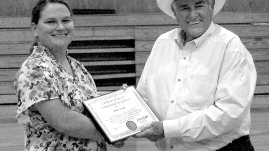 Jolene Volek accepts the certificate of Congressional Recognition from U.S. Representative of Texas John Carter on Aug. 17. Photo by Evan Hale