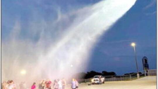 Taylor High School Band and Color Guard students celebrate the end of summer practice in the 100 plus degree heat with a visit from the Taylor Fire Department.