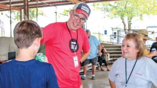 Mayors Brandt Rydell and Monica Stojaník talk at the Taylor International Barbecue Cookoff in Taylor Aug. 20.